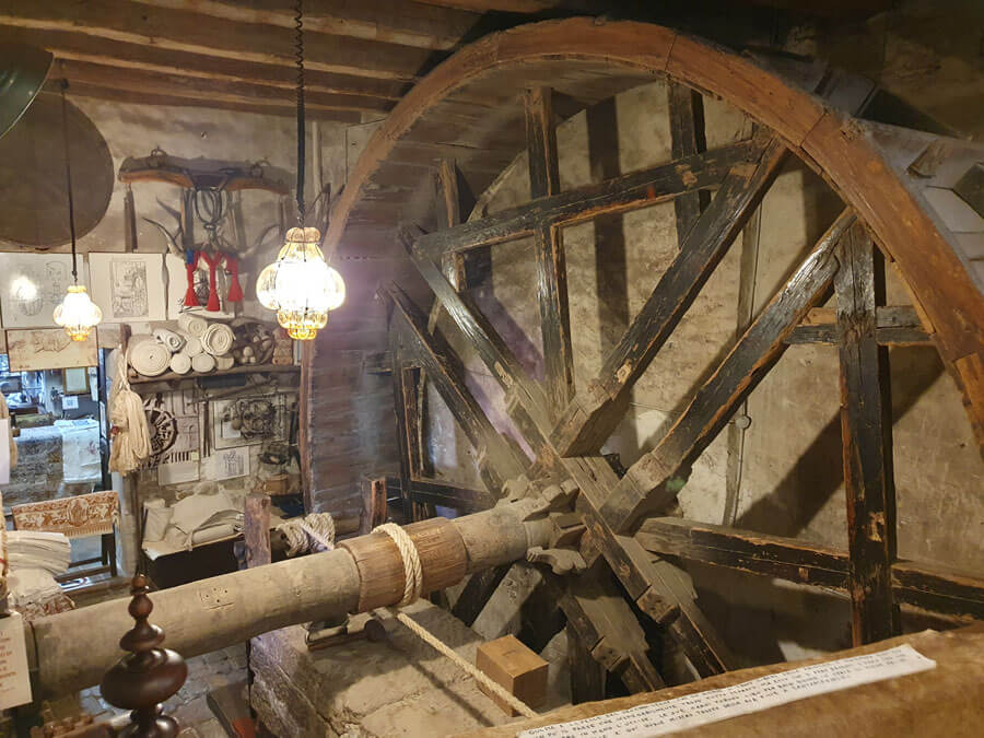 Large wooden mangle wheel at the Stamperia Marchi printing shop