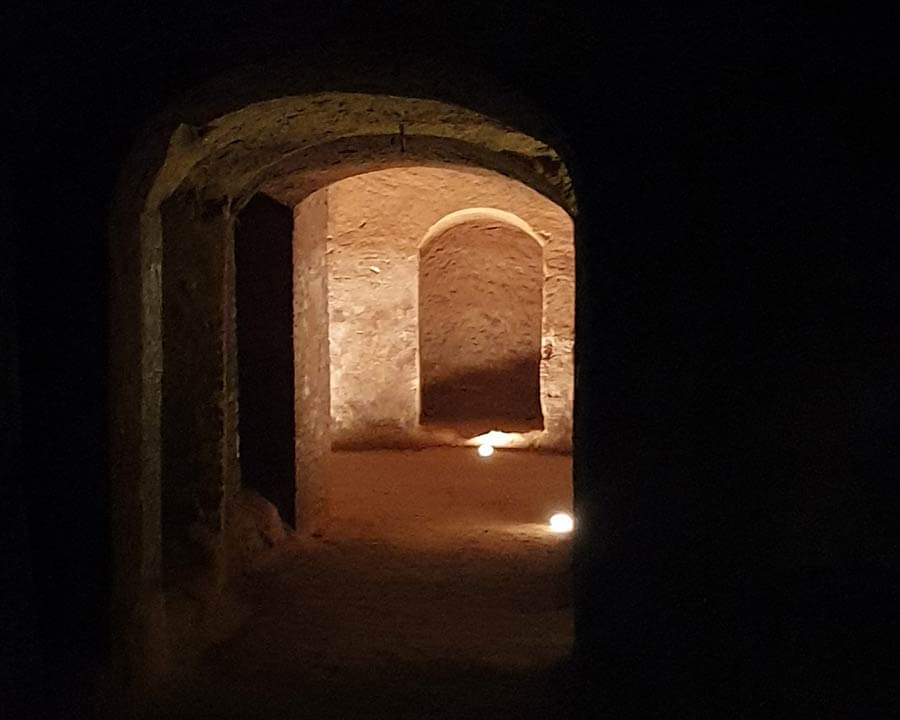 Illuminated corner of a dark man-made cave in Santarcangelo di Romagna